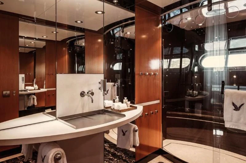 a bathroom with a large mirror aboard MALTESE FALCON Yacht for Sale
