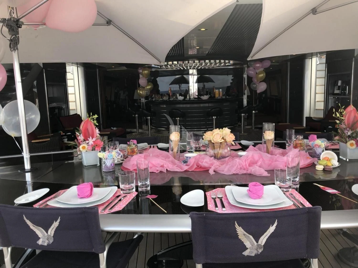 a table with plates and cups aboard MALTESE FALCON Yacht for Sale