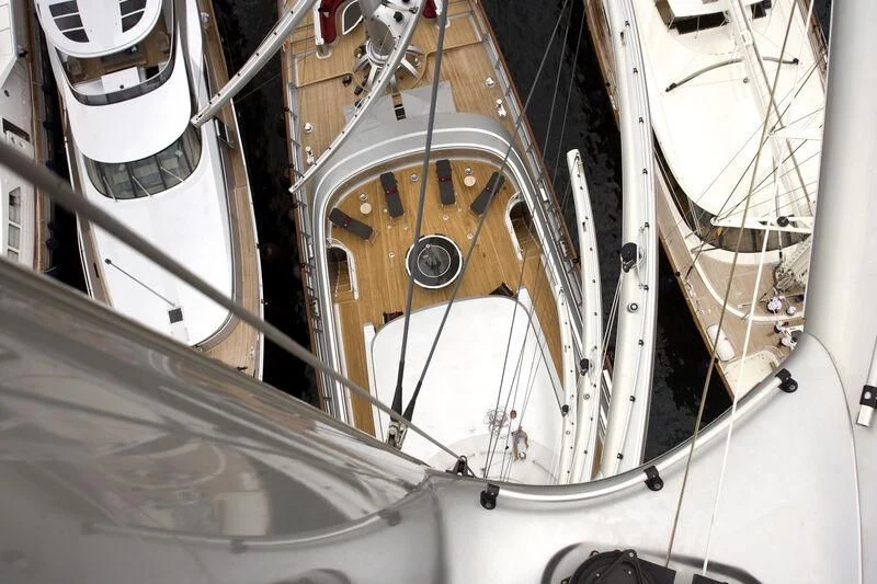 a close-up of a white ship's wheel aboard MALTESE FALCON Yacht for Sale