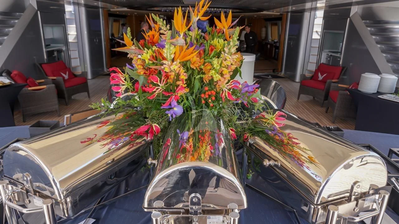 a car with a large bouquet of flowers in the back aboard MALTESE FALCON Yacht for Sale