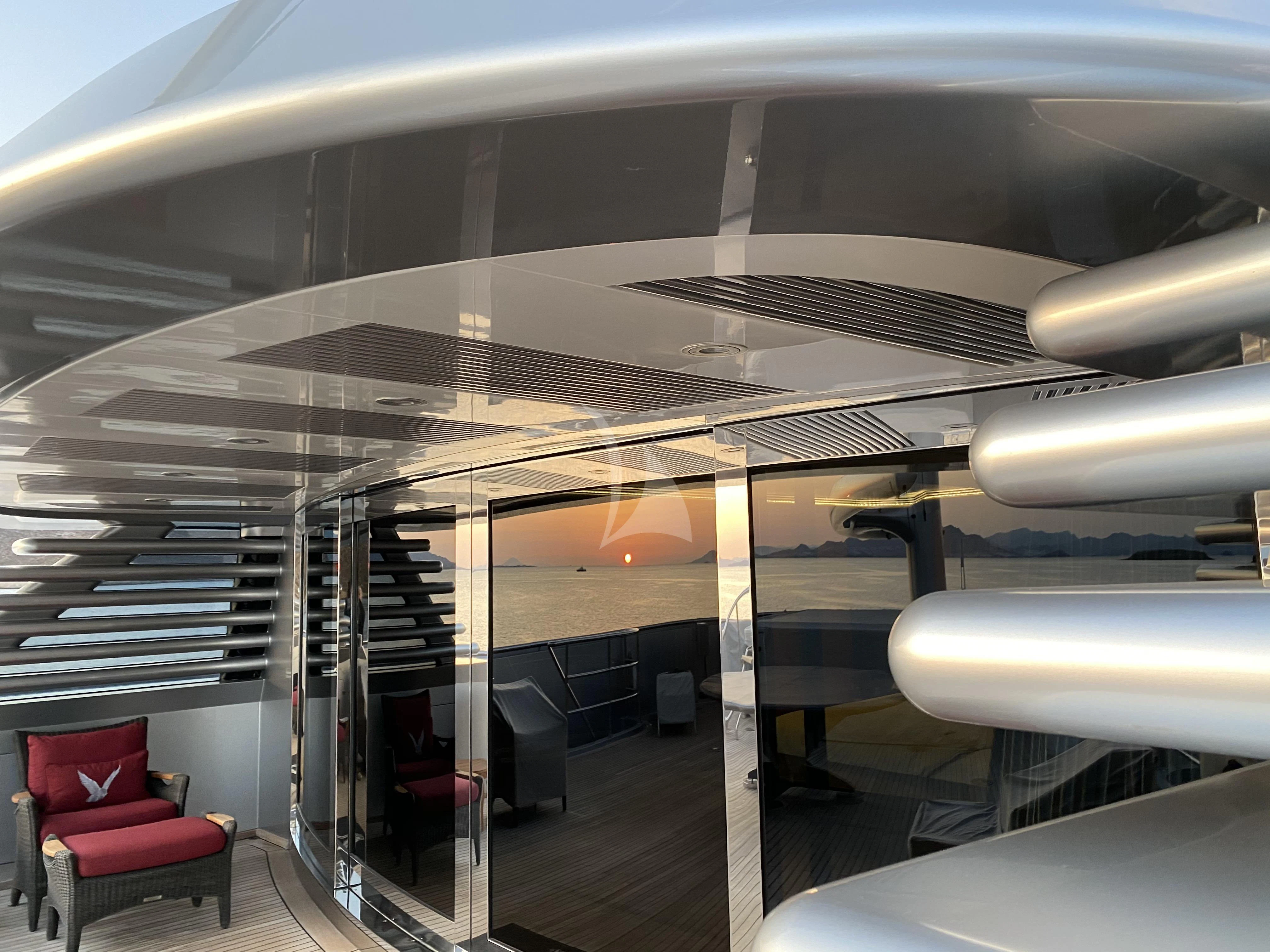 a room with chairs and a table aboard MALTESE FALCON Yacht for Sale