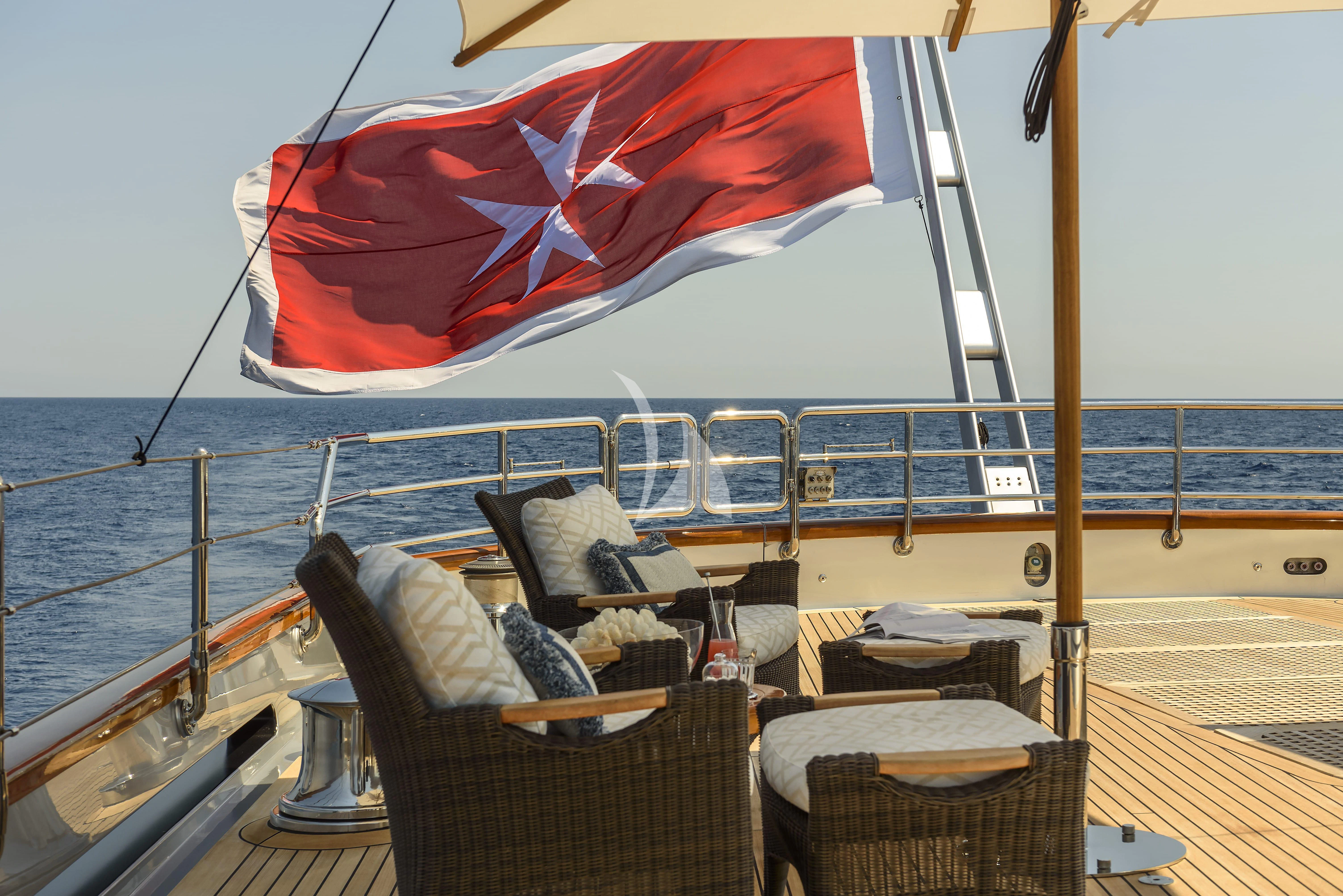 a boat with a red and white flag on it aboard MALTESE FALCON Yacht for Sale