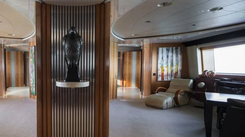 a room with a lamp and a couch aboard MALTESE FALCON Yacht for Sale