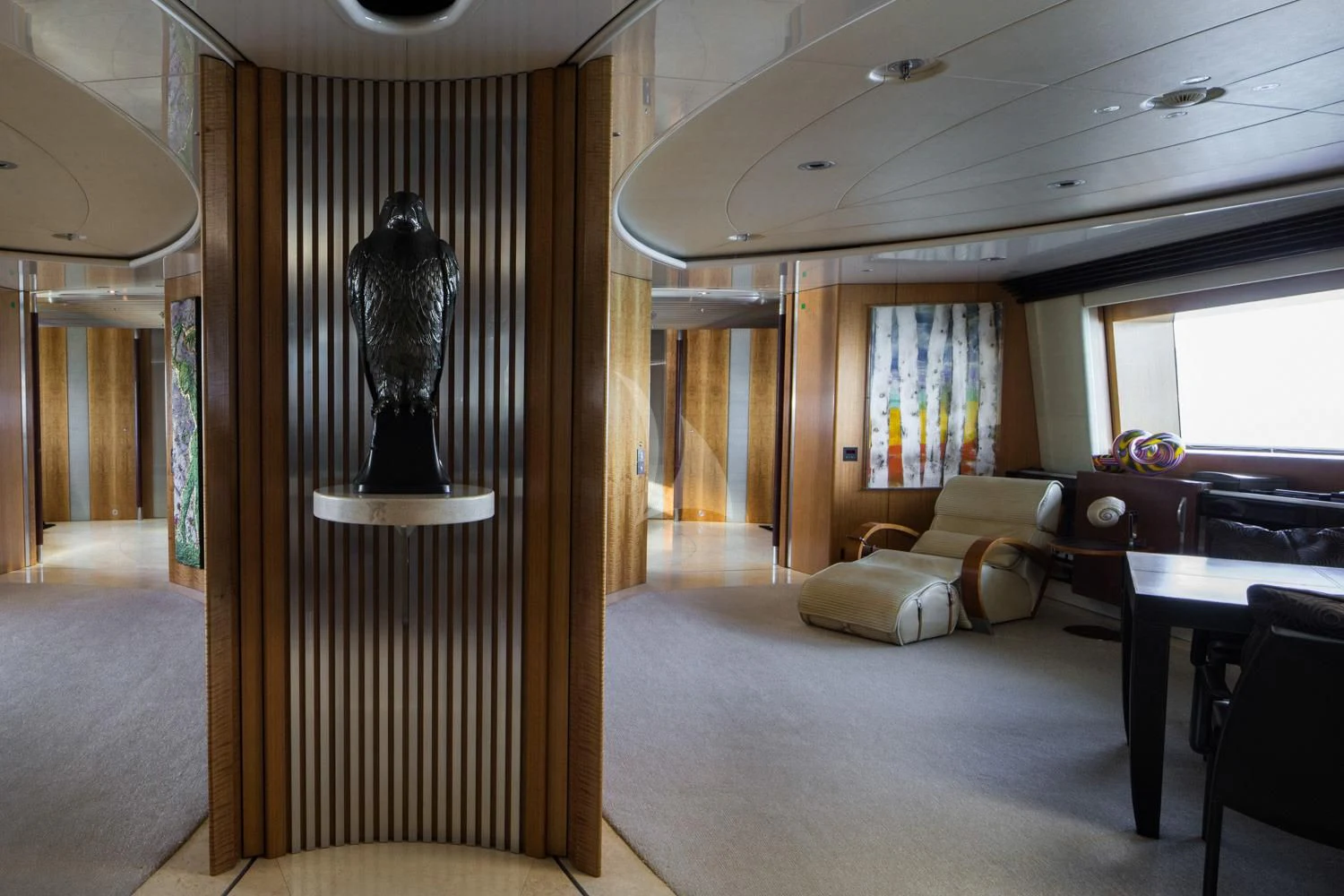 a large living room with a large black lamp aboard MALTESE FALCON Yacht for Sale