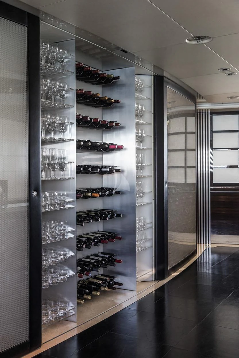 a room with shelves and wine glasses aboard MALTESE FALCON Yacht for Sale