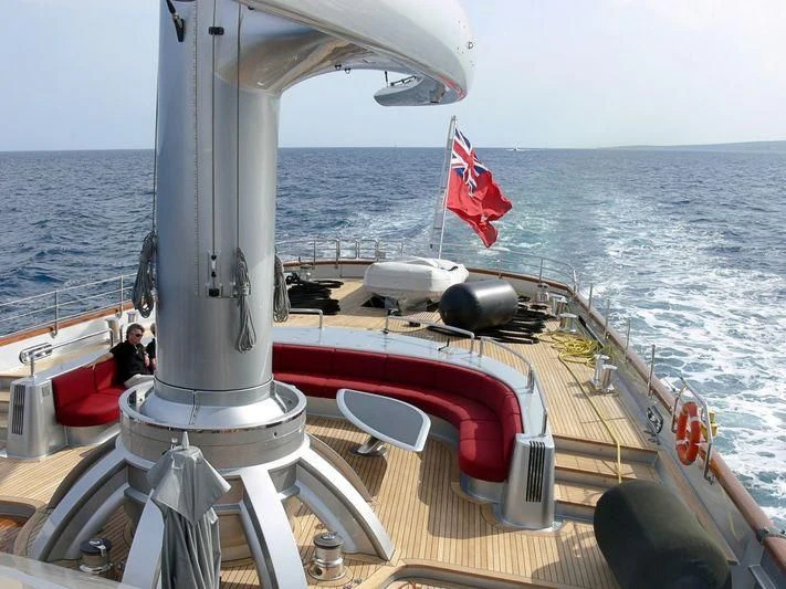 a boat with a flag on the front aboard MALTESE FALCON Yacht for Sale