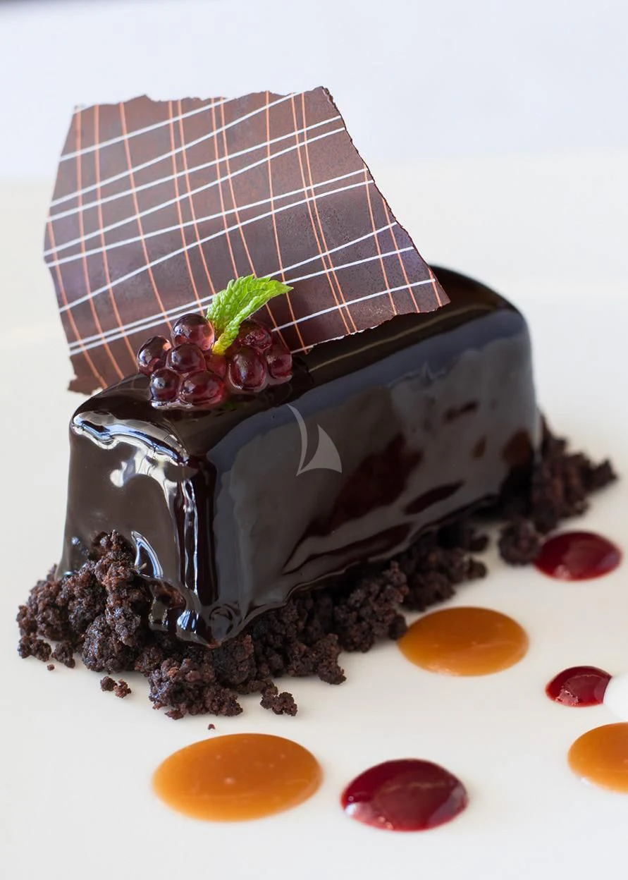 a chocolate cake with chocolate and candy aboard MALTESE FALCON Yacht for Sale