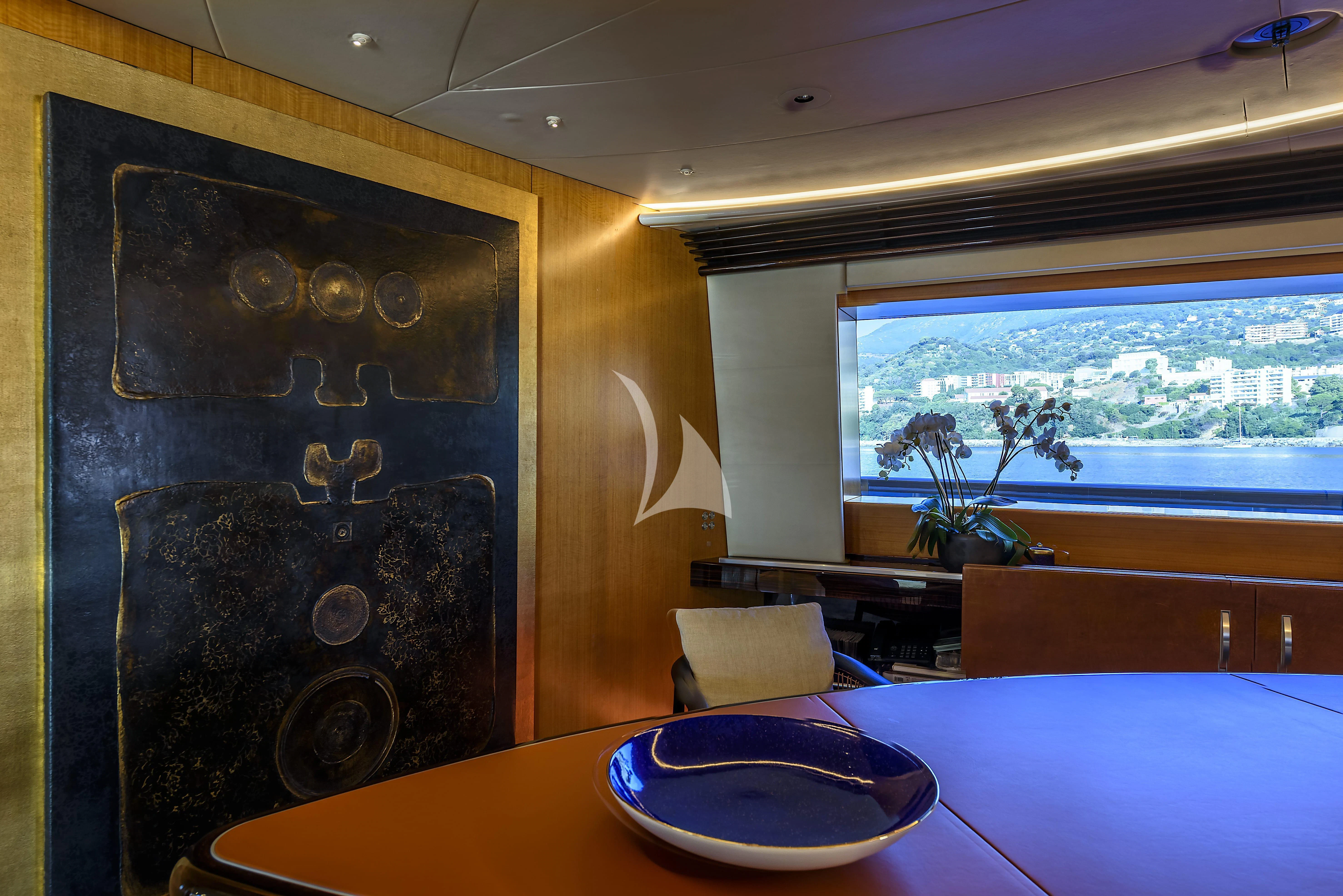 a room with a table and chairs aboard MALTESE FALCON Yacht for Sale