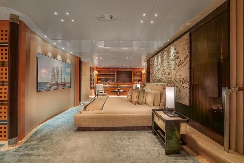 a room with a bed and a mirror aboard MALTESE FALCON Yacht for Sale
