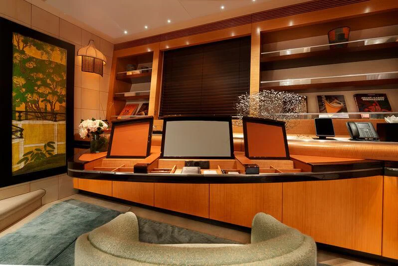 a room with a desk and a couch aboard MALTESE FALCON Yacht for Sale