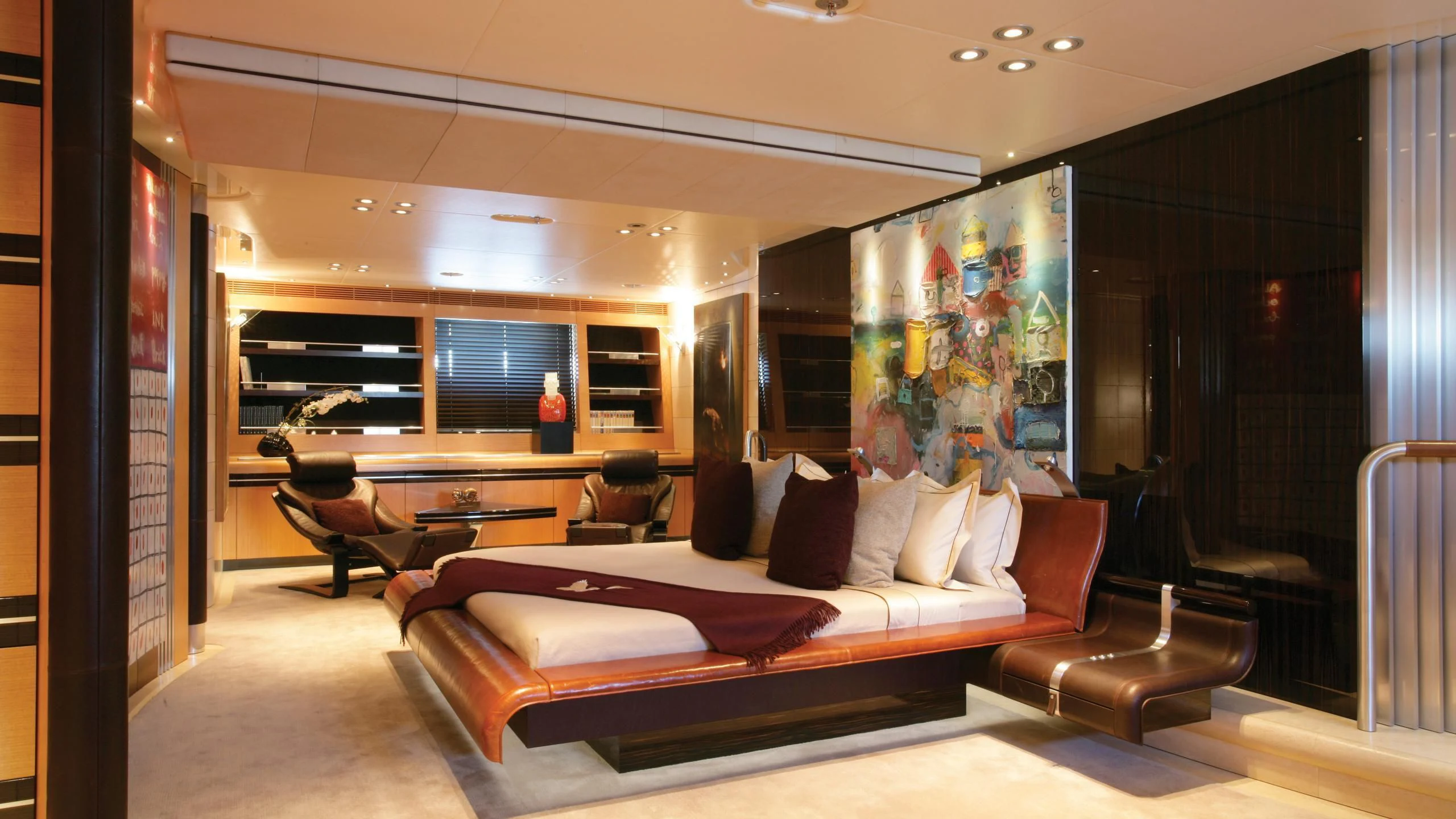 a large living room with a large screen aboard MALTESE FALCON Yacht for Sale