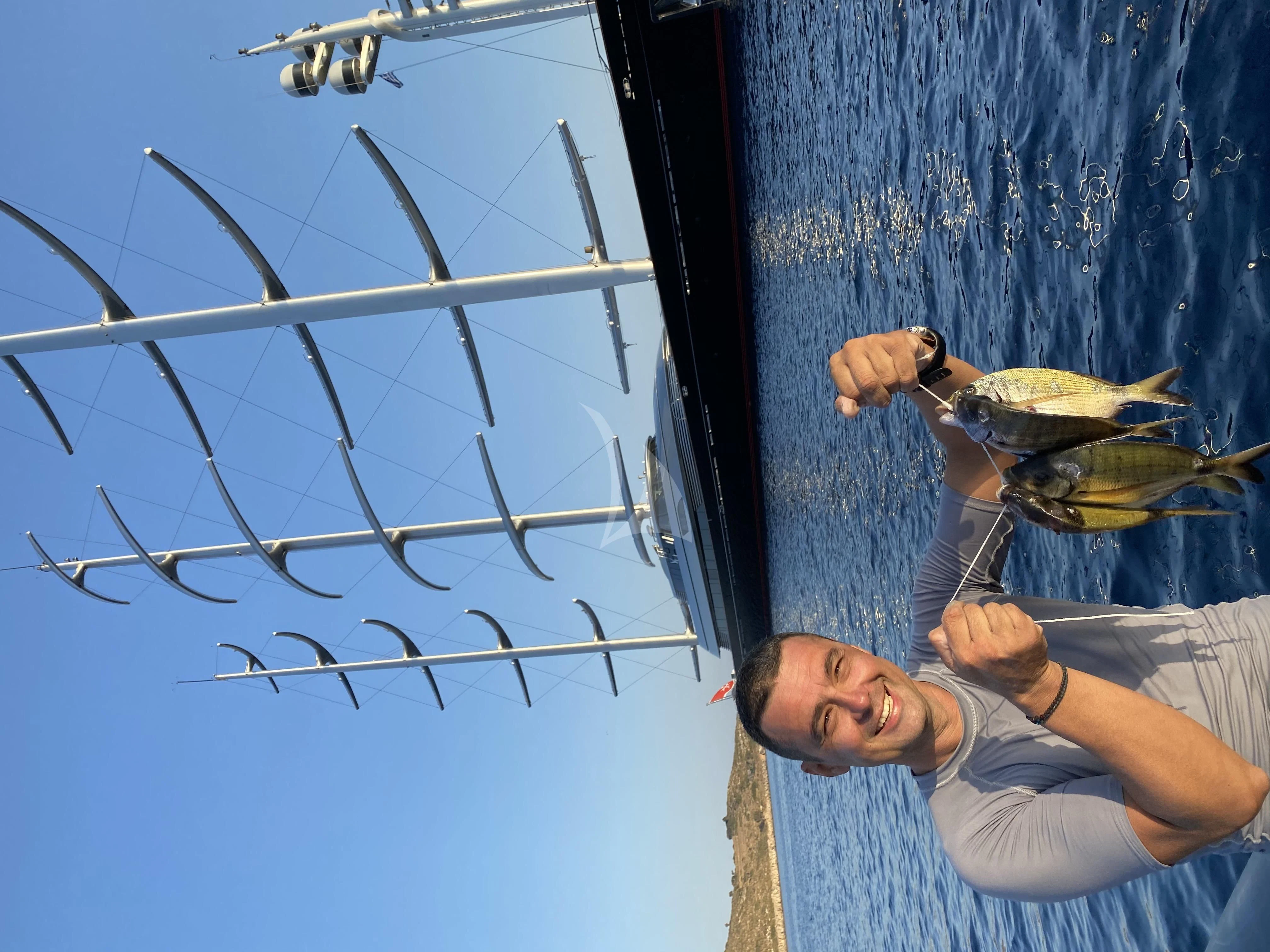 a person holding a bird aboard MALTESE FALCON Yacht for Sale