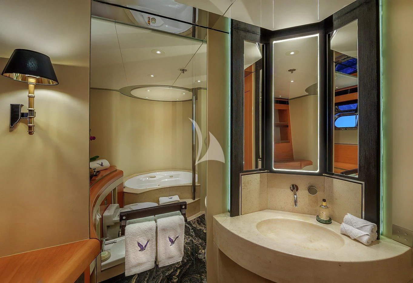 a bathroom with a large mirror aboard MALTESE FALCON Yacht for Sale