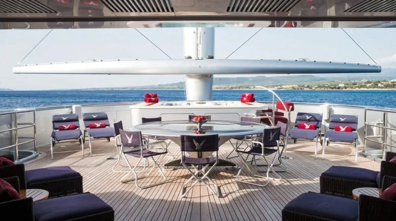 a room with a table and chairs aboard MALTESE FALCON Yacht for Sale