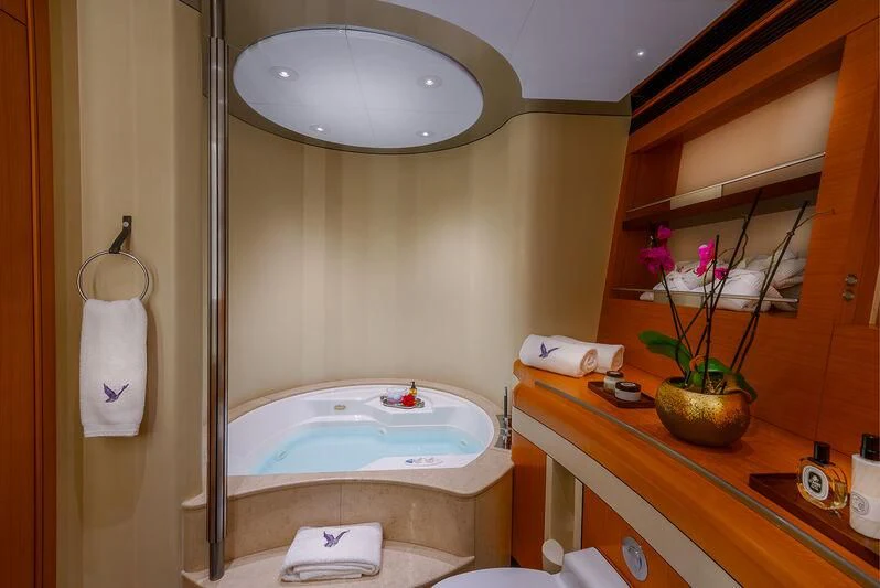 a bathroom with a large bathtub aboard MALTESE FALCON Yacht for Sale
