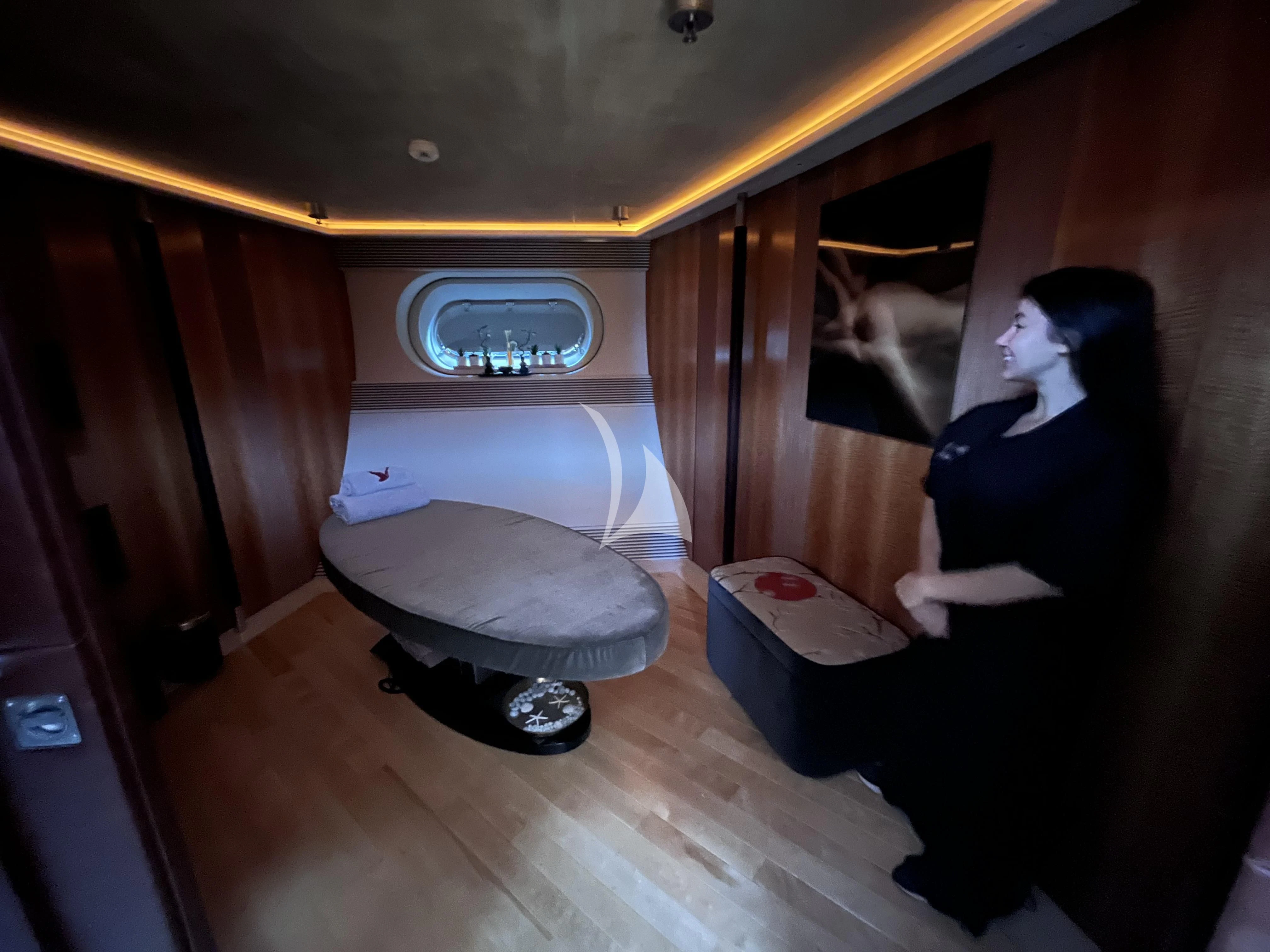 a couple of people in a room aboard MALTESE FALCON Yacht for Sale