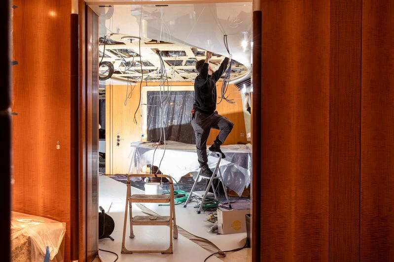 a person working on a project aboard MALTESE FALCON Yacht for Sale