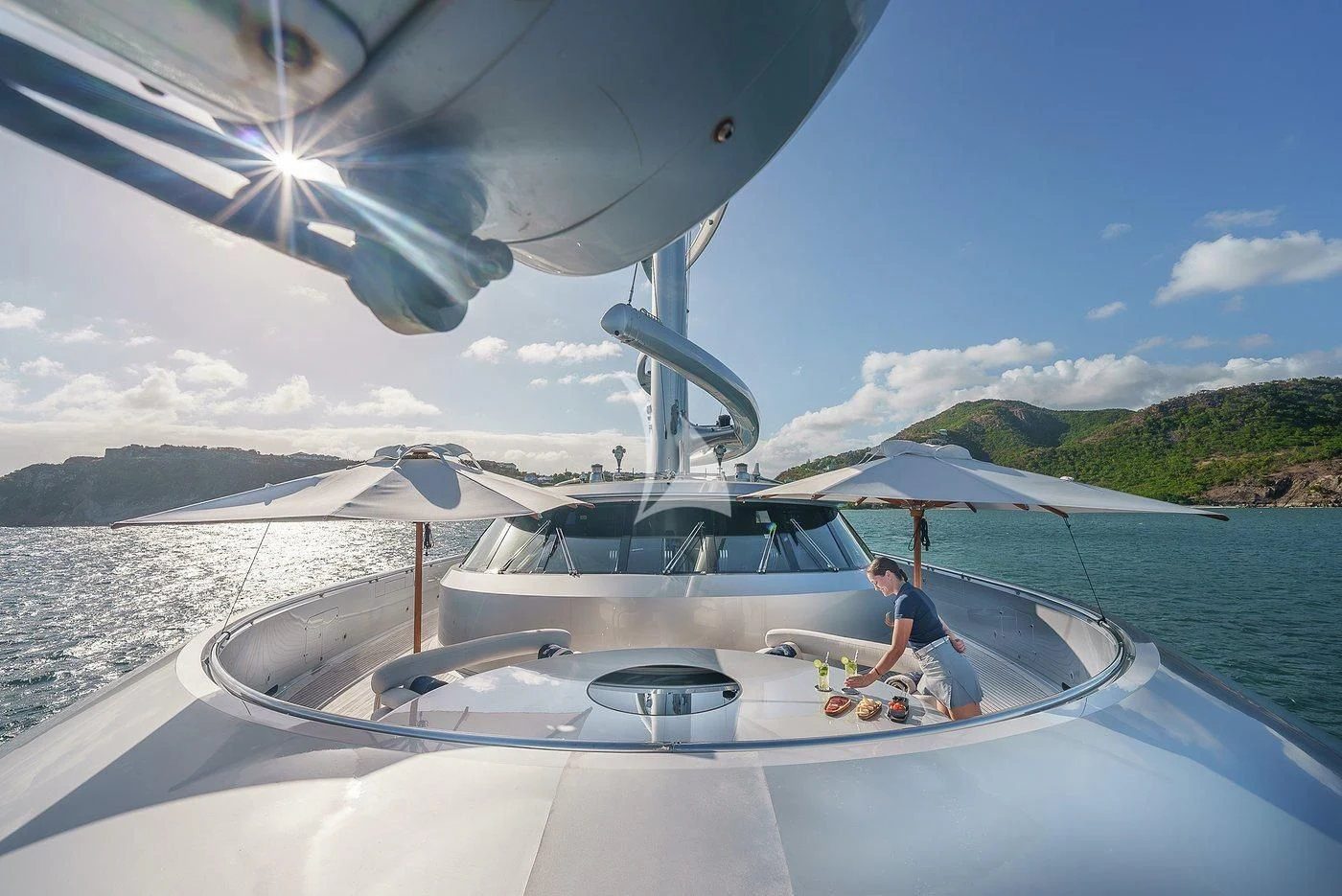 a person sitting on a boat aboard MALTESE FALCON Yacht for Sale