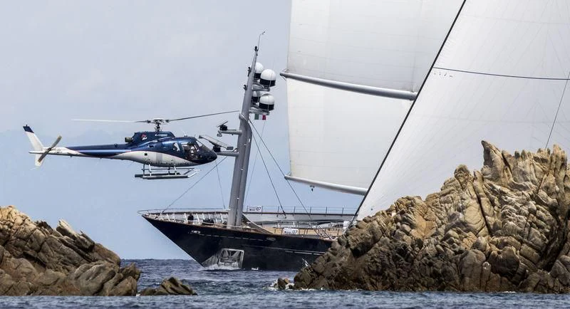 a helicopter flying over a boat aboard MALTESE FALCON Yacht for Sale