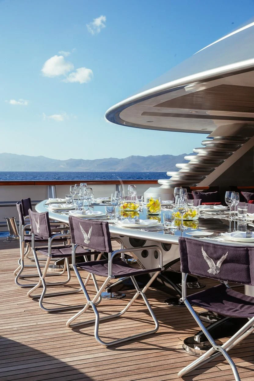 a table set for a dinner party aboard MALTESE FALCON Yacht for Sale