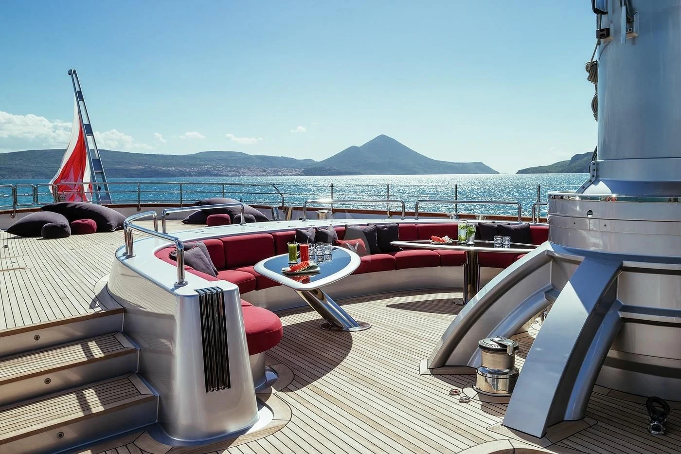 a deck with a table and chairs on it aboard MALTESE FALCON Yacht for Sale