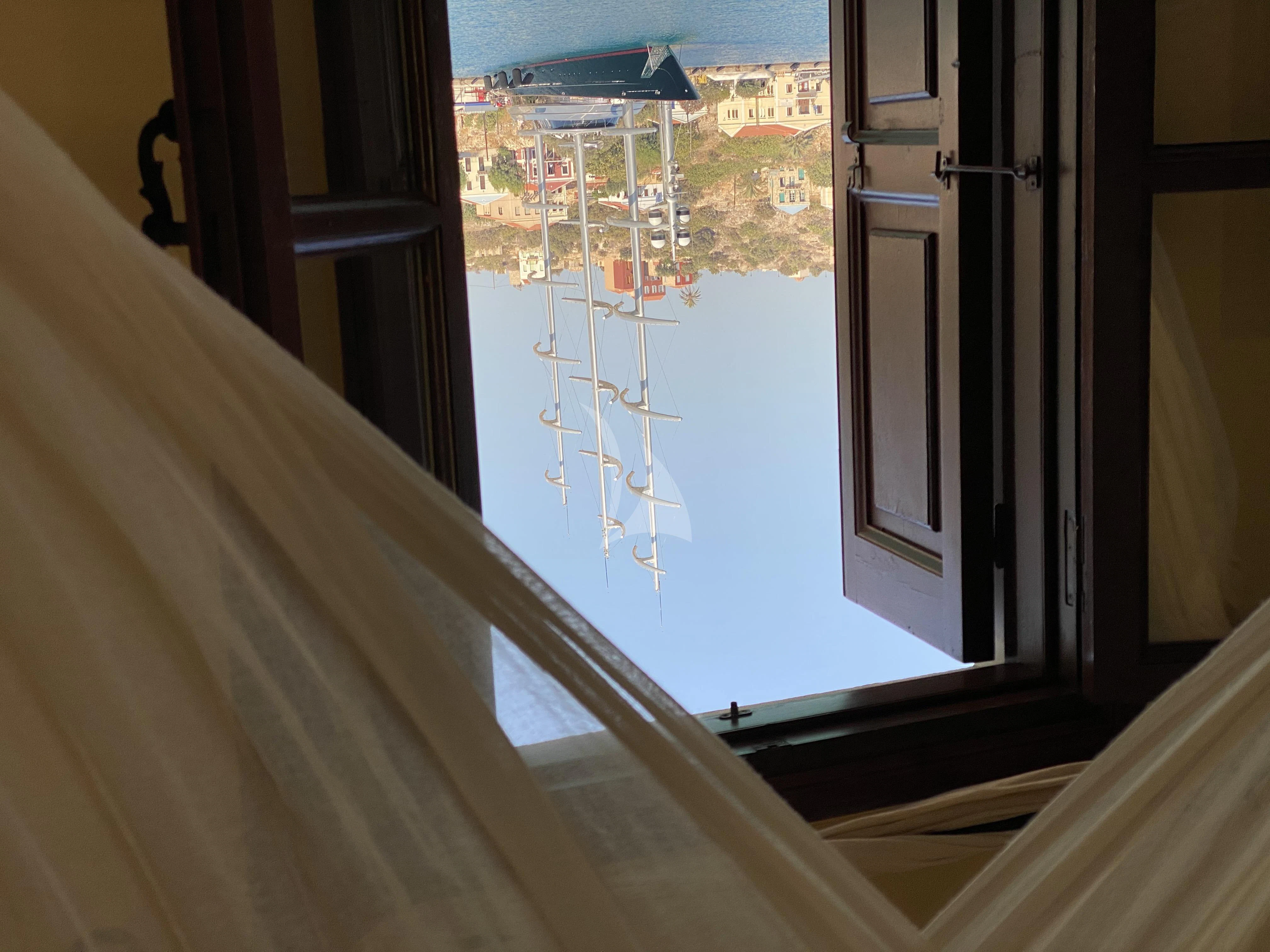 a view of a beach from a balcony aboard MALTESE FALCON Yacht for Sale