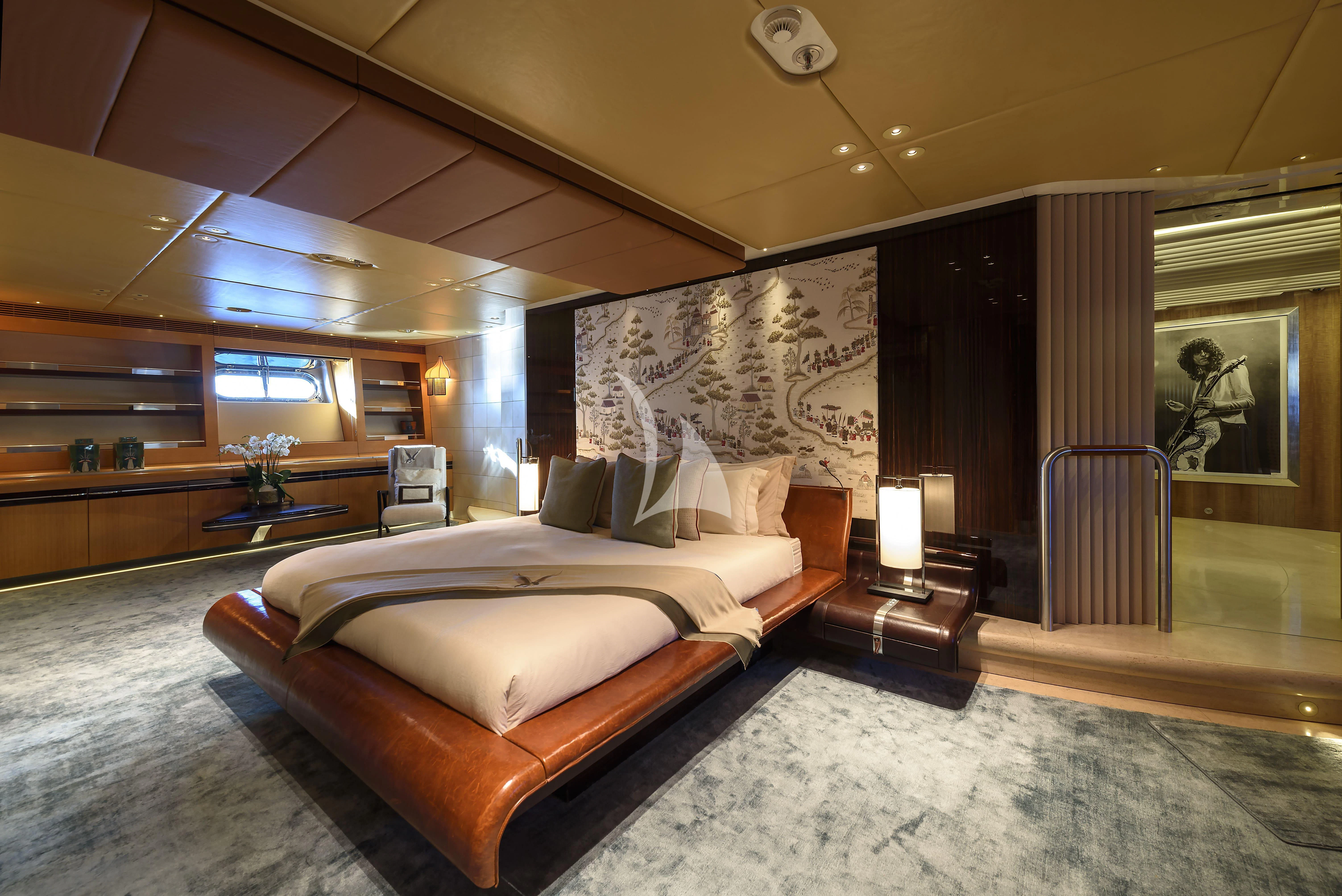 a large hotel room with a large bed and a large window aboard MALTESE FALCON Yacht for Sale