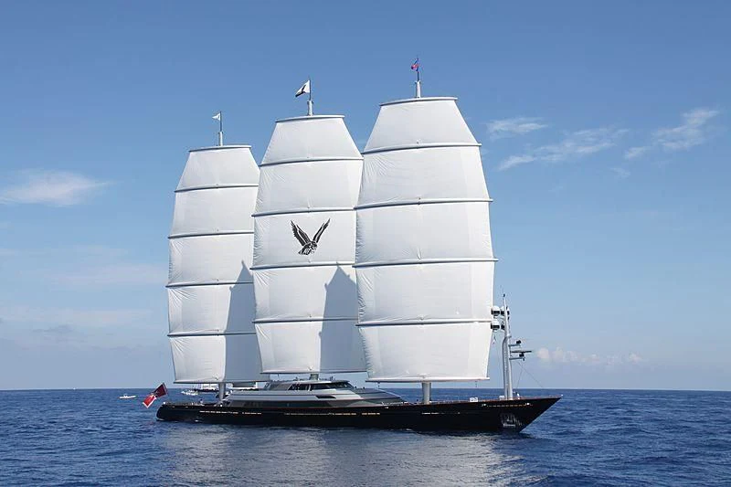 a large white boat with a flag on it aboard MALTESE FALCON Yacht for Sale