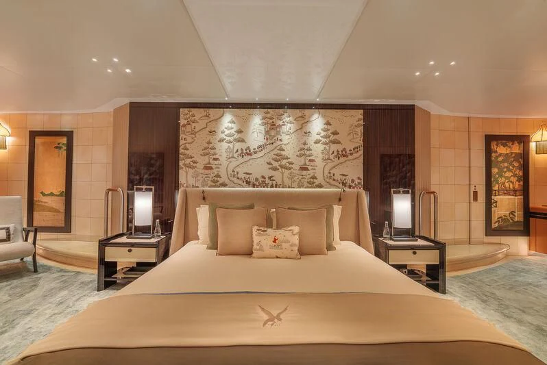 a large bed with a white comforter and pillows aboard MALTESE FALCON Yacht for Sale