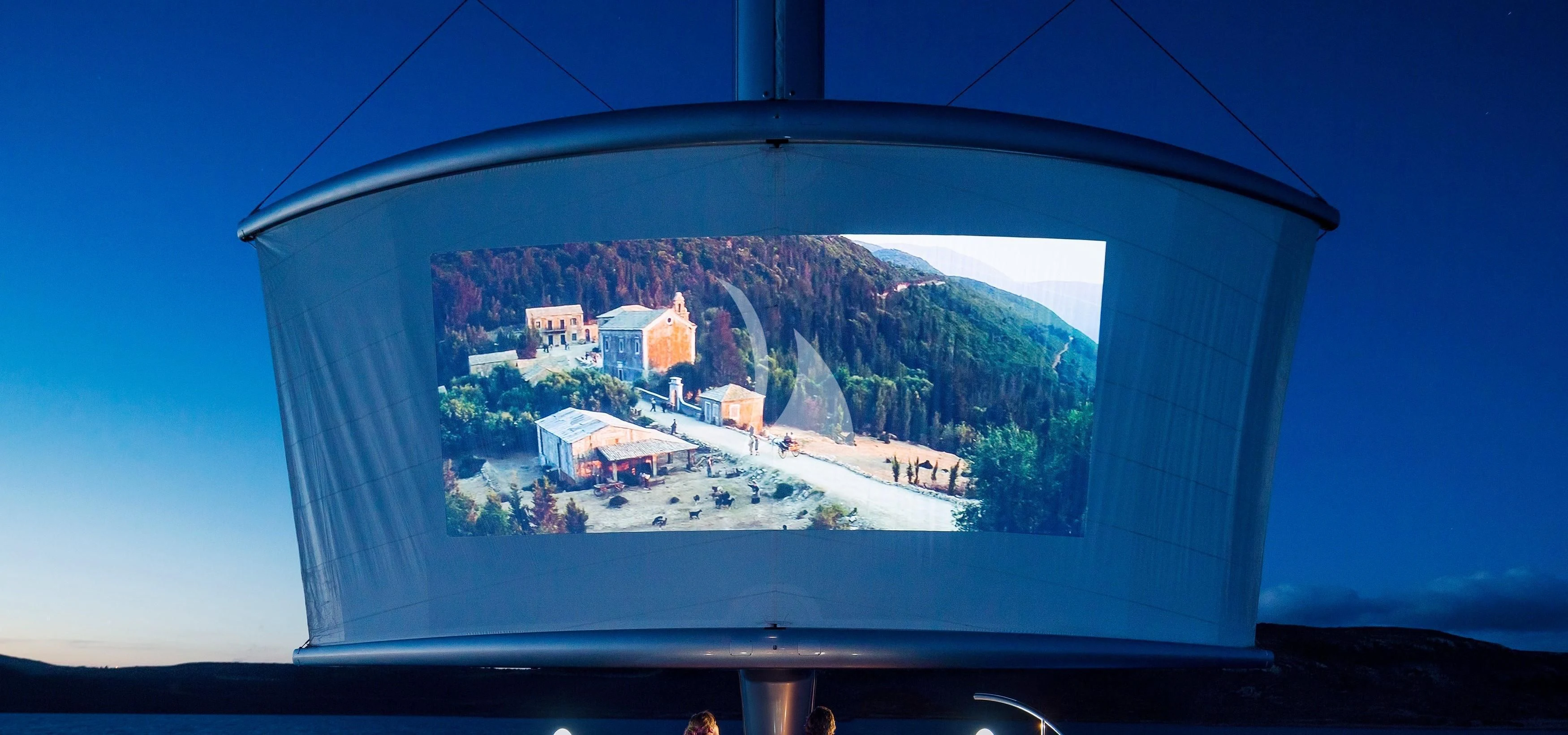 a window with a view of a city and mountains aboard MALTESE FALCON Yacht for Sale
