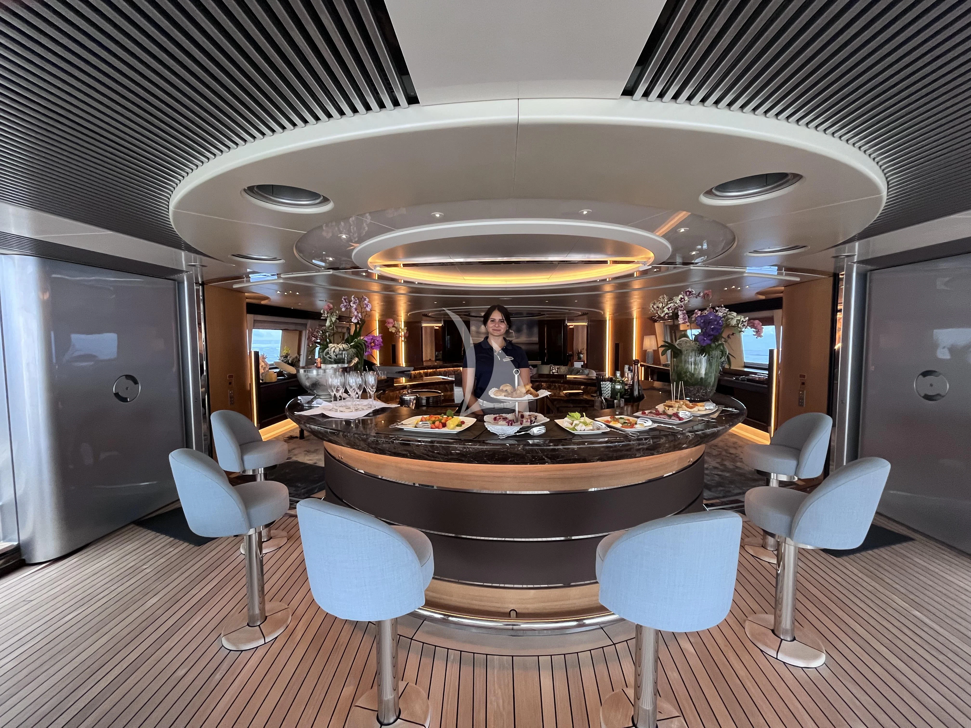 a person standing at a counter in a restaurant aboard MALTESE FALCON Yacht for Sale