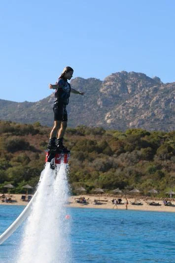 a man jumping into a lake aboard MALTESE FALCON Yacht for Sale