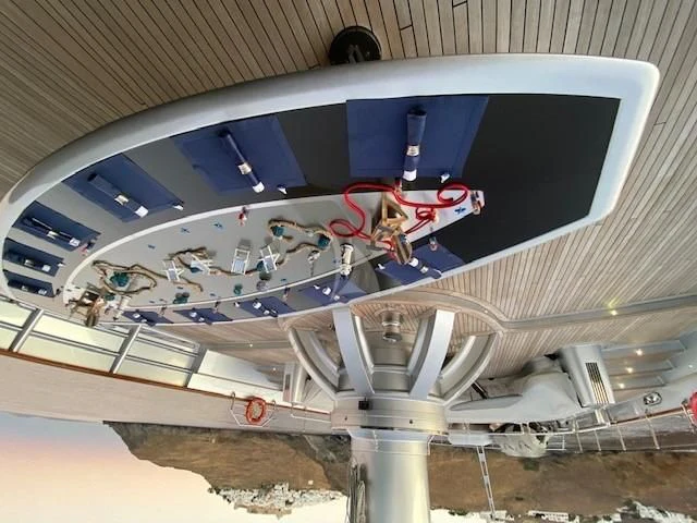 a large white and blue building with a large glass ceiling aboard MALTESE FALCON Yacht for Sale