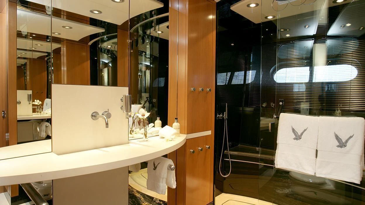 a bathroom with a sink and a mirror aboard MALTESE FALCON Yacht for Sale