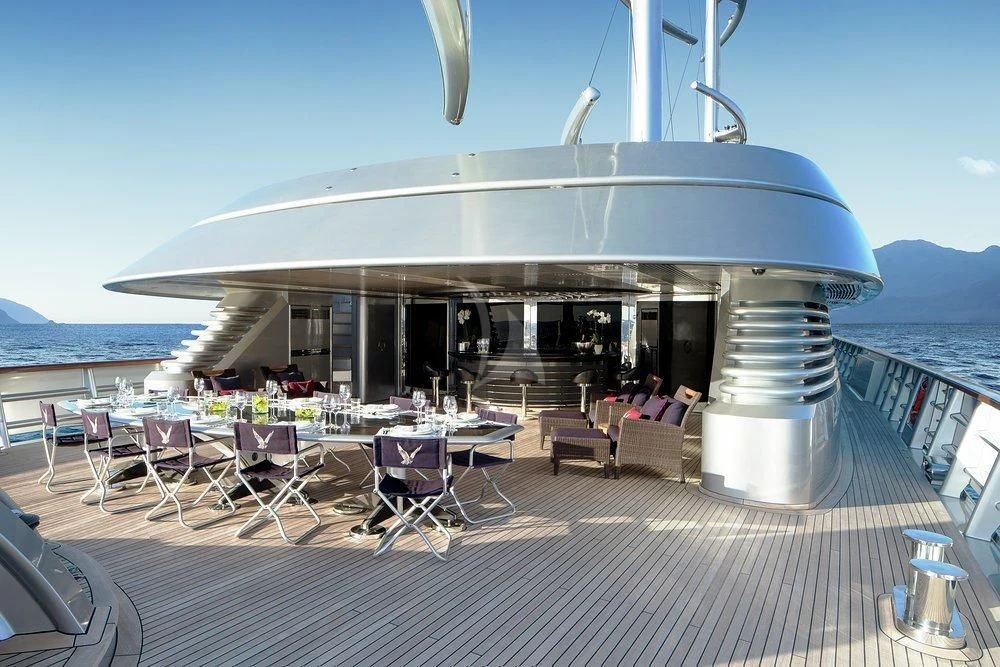 a large white building with a roof over a body of water aboard MALTESE FALCON Yacht for Sale