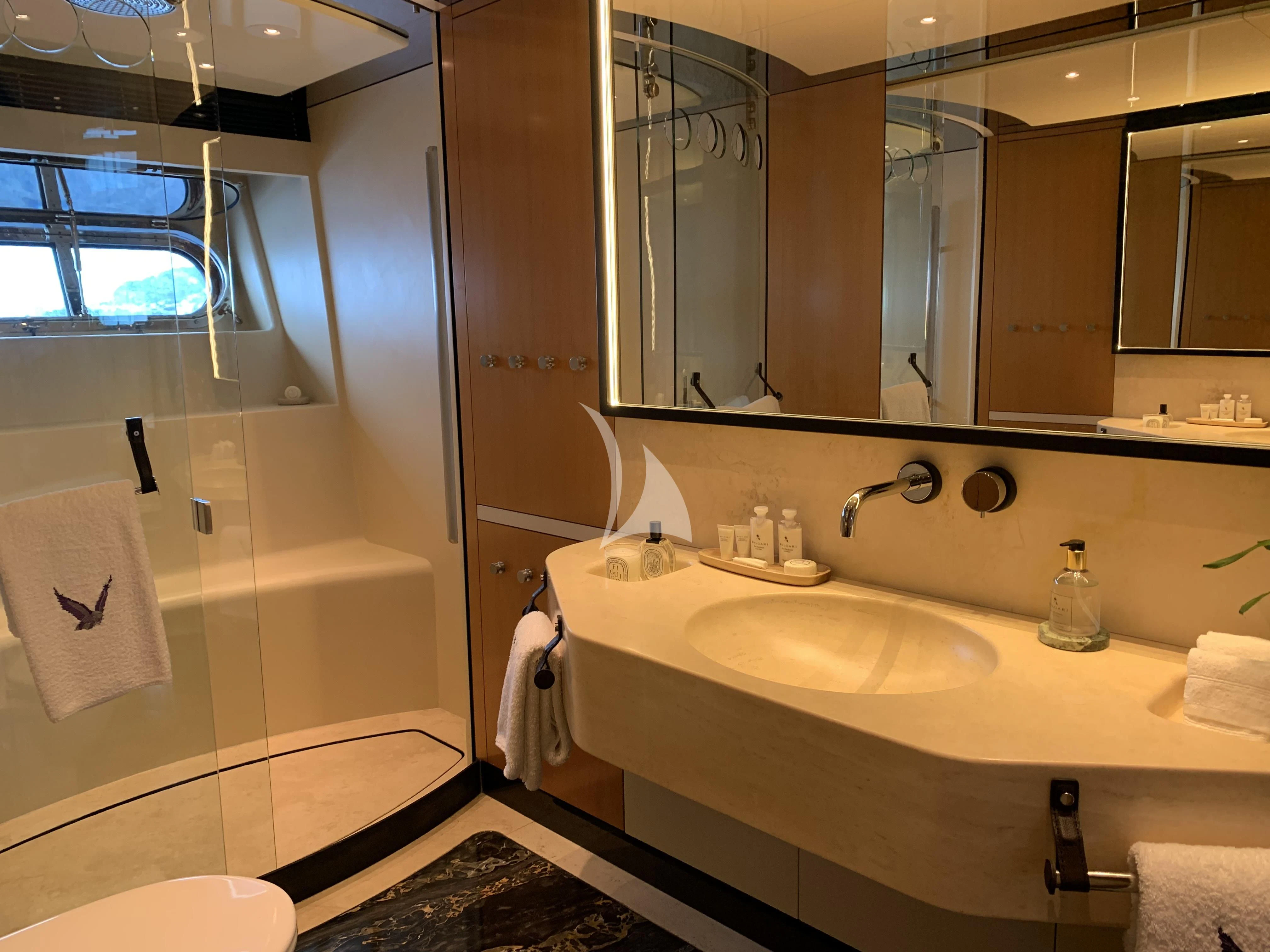 a bathroom with a large mirror aboard MALTESE FALCON Yacht for Sale