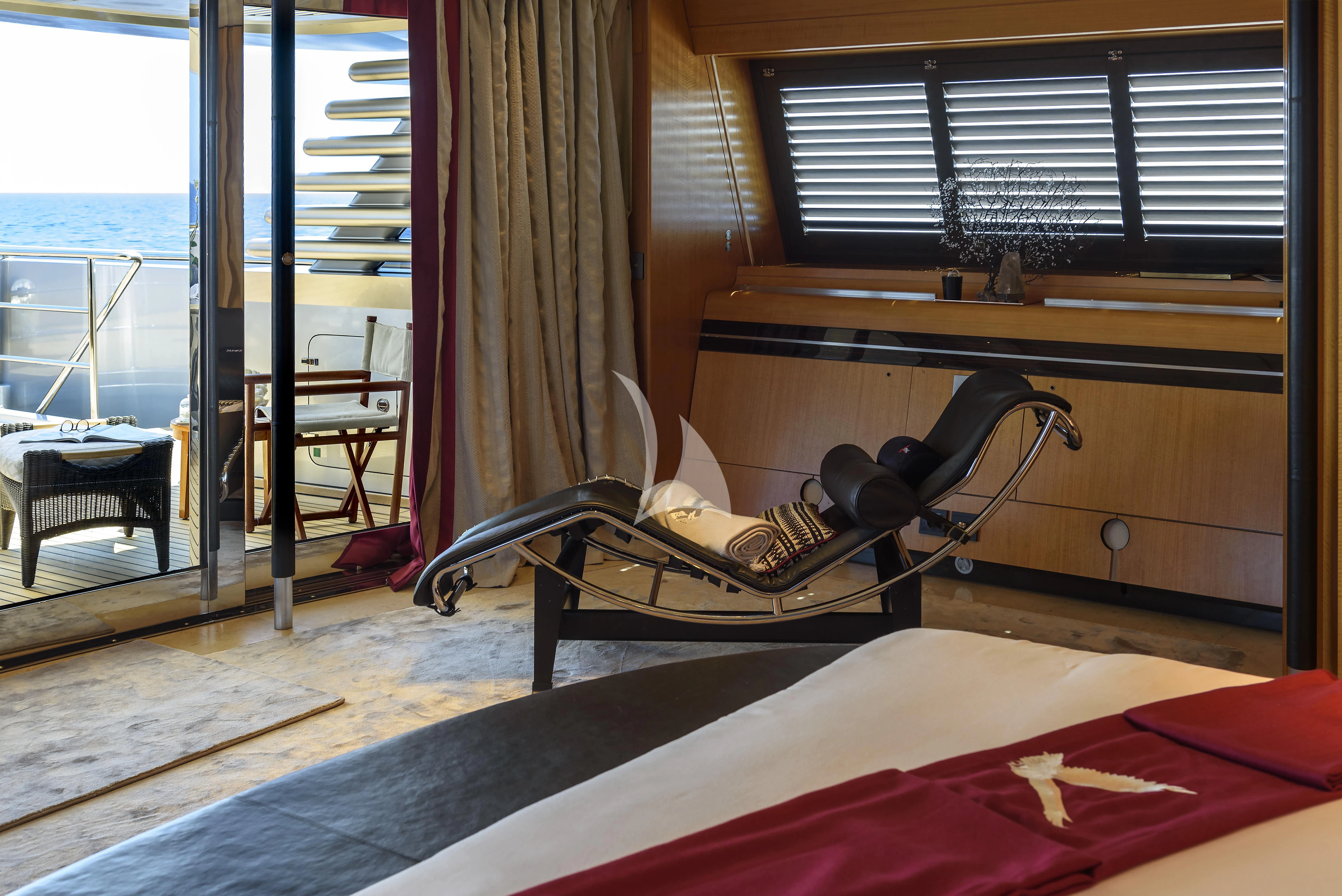 a room with a bed and a fan aboard MALTESE FALCON Yacht for Sale