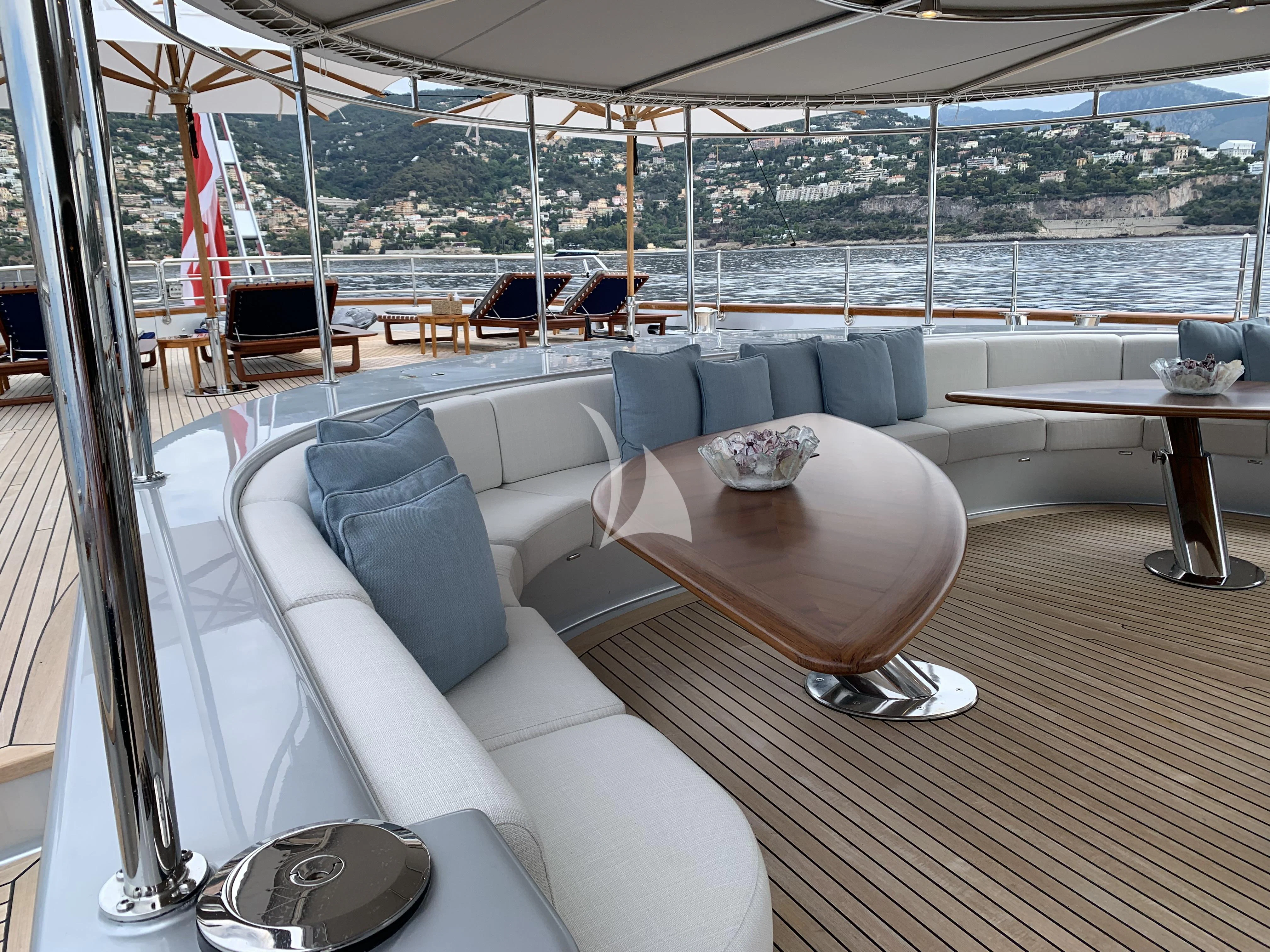 a living room with a large window aboard MALTESE FALCON Yacht for Sale