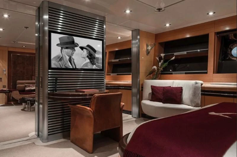 a room with a tv and couches aboard MALTESE FALCON Yacht for Sale