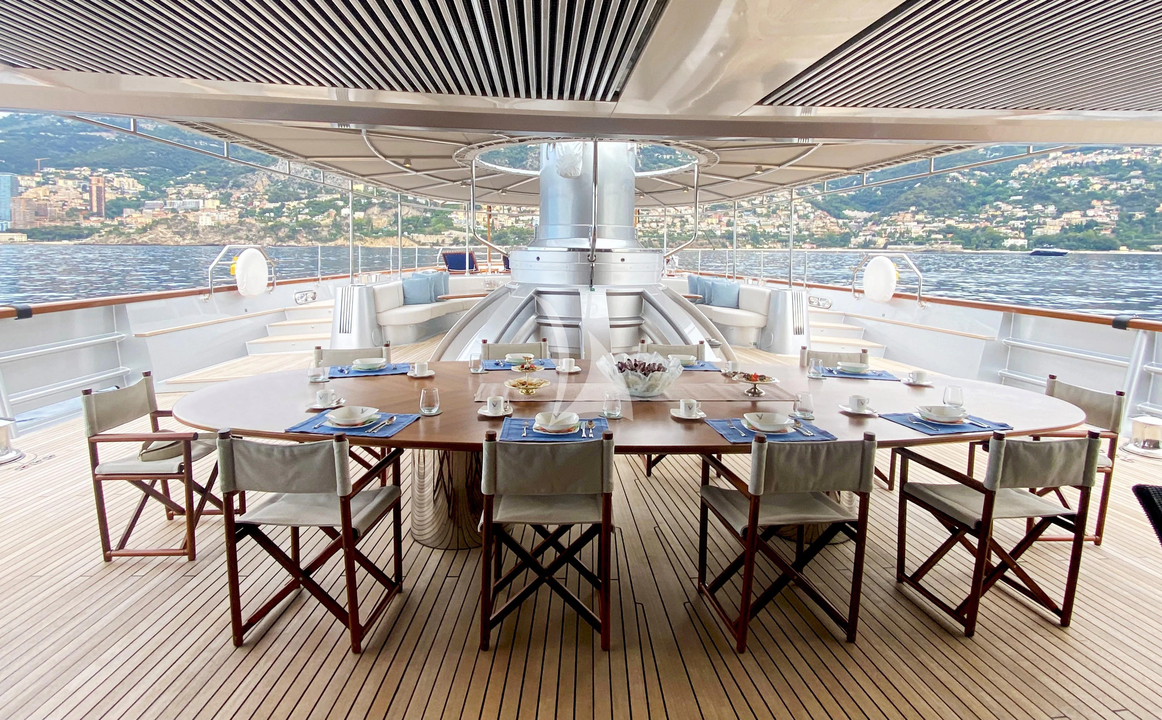 a table set for a meal aboard MALTESE FALCON Yacht for Sale