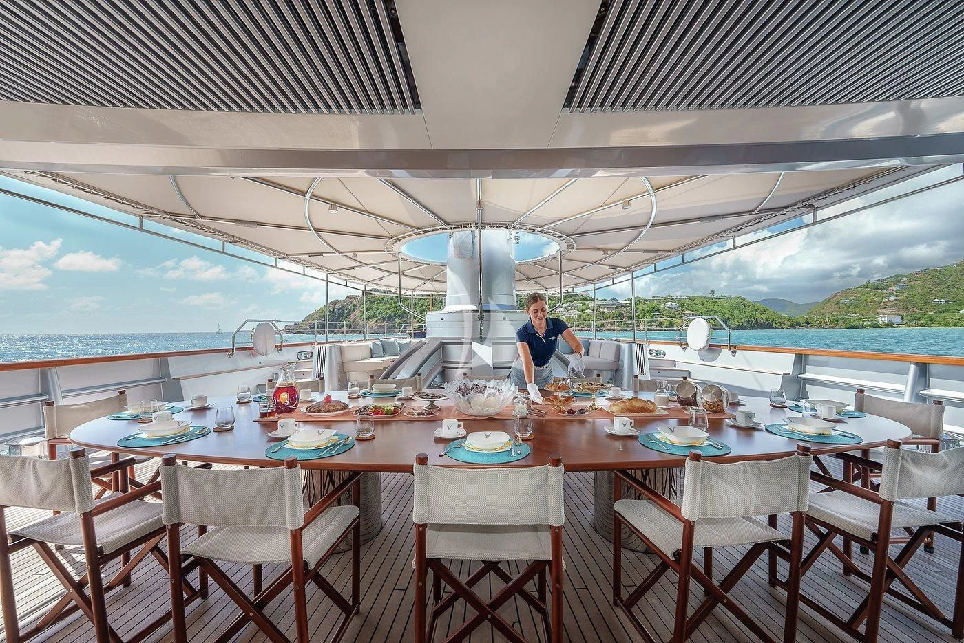 a person sitting at a table aboard MALTESE FALCON Yacht for Sale