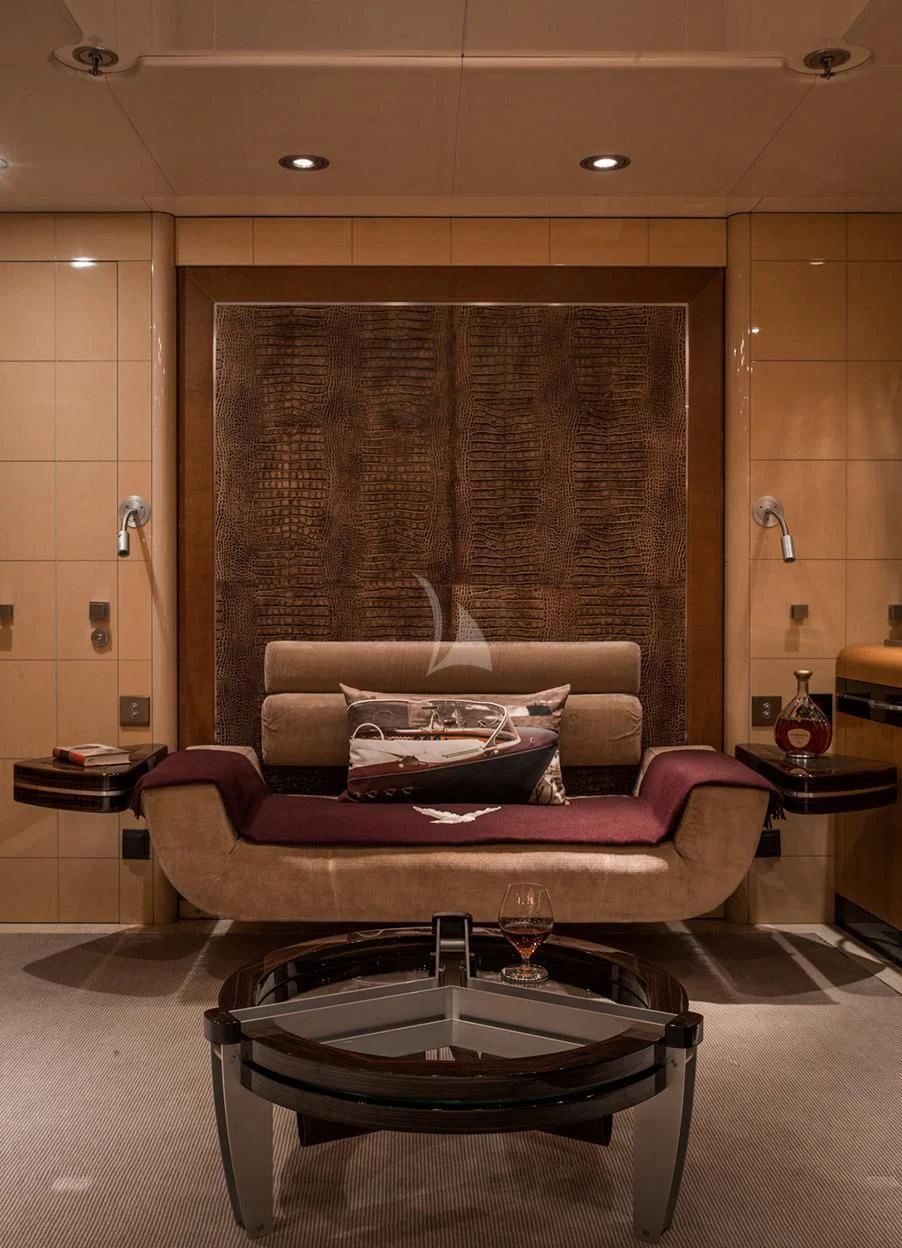 a living room with a table and chairs aboard MALTESE FALCON Yacht for Sale