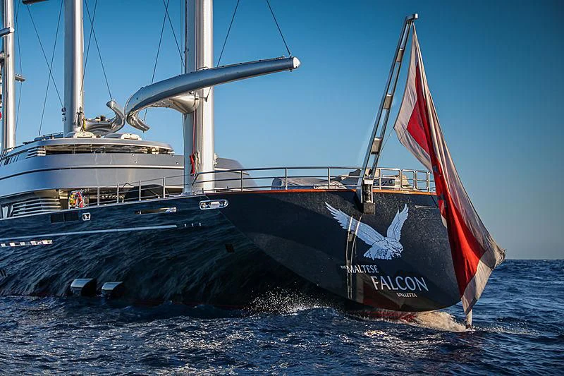 a boat with a red and white sail on the water aboard MALTESE FALCON Yacht for Sale