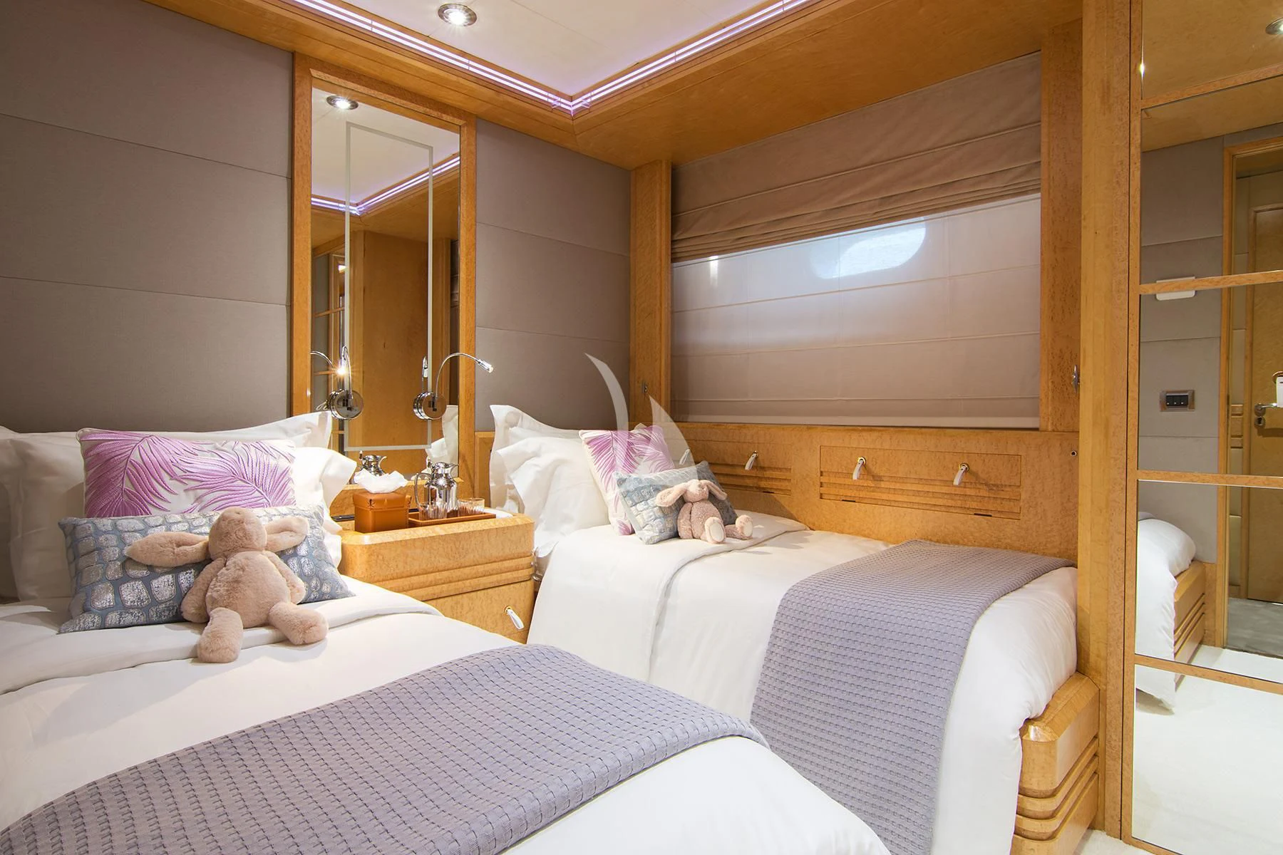 a bedroom with a teddy bear on the bed aboard BELLA STELLA Yacht for Charter