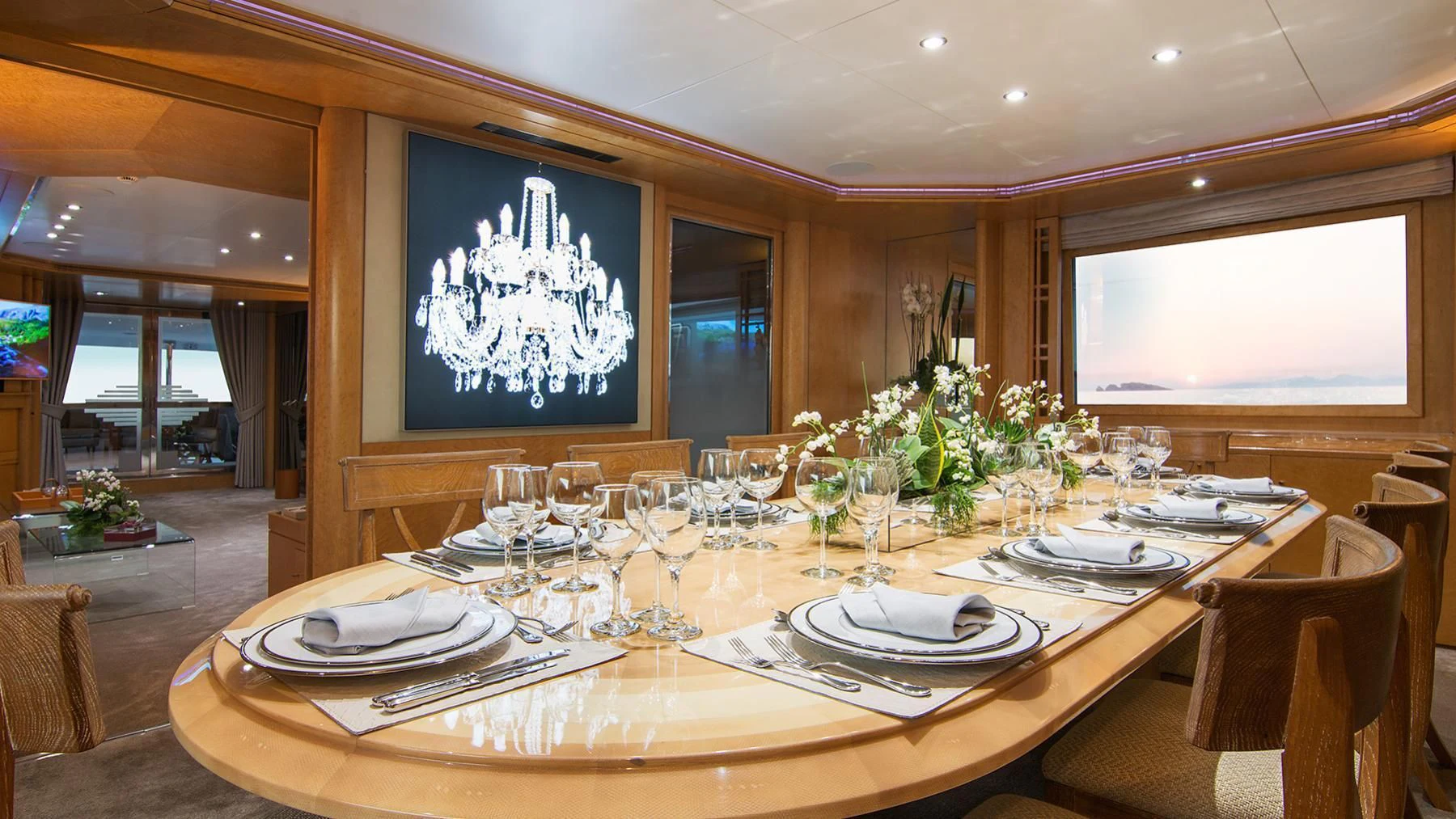a dining table with plates and glasses aboard BELLA STELLA Yacht for Charter