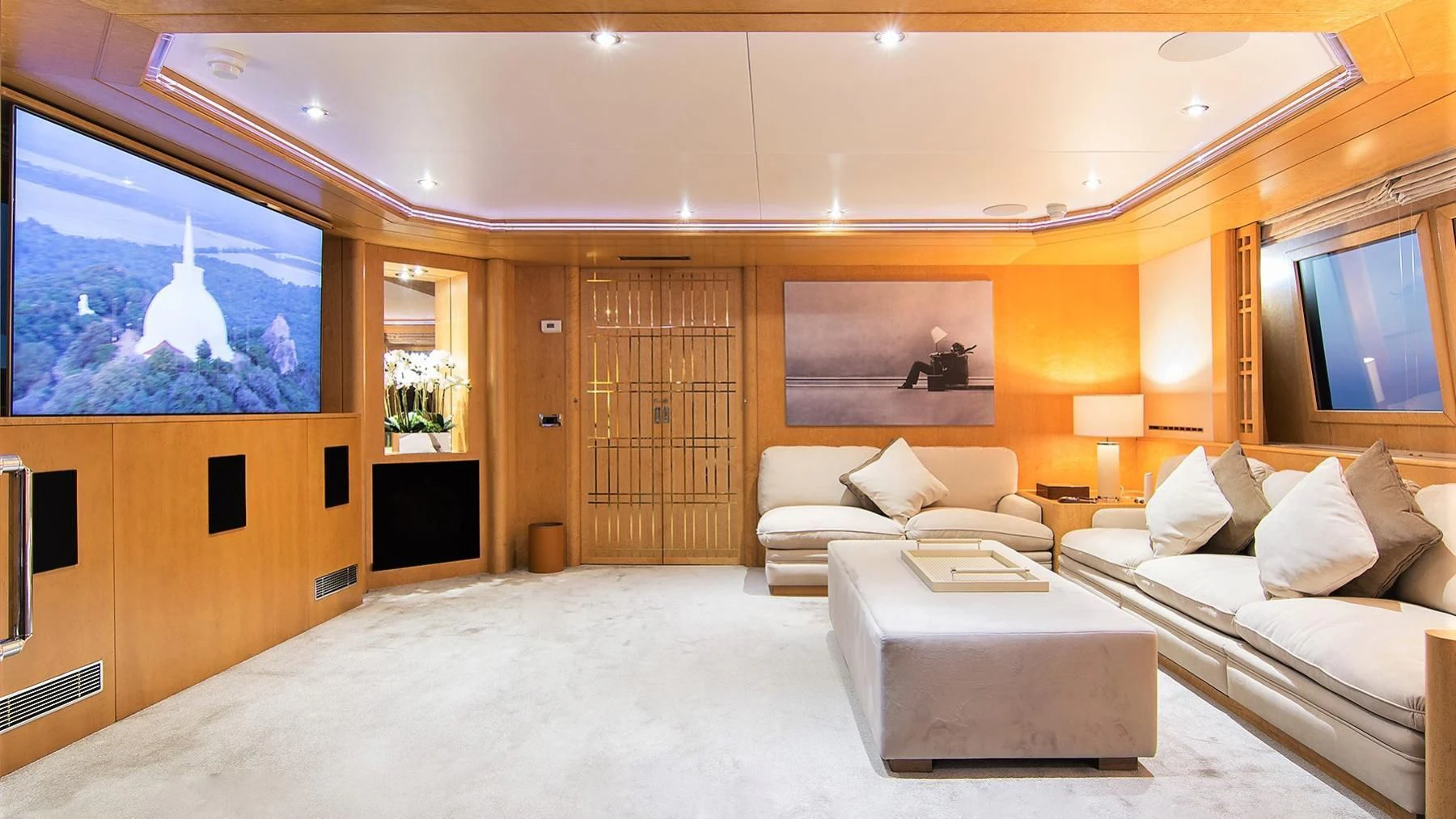 a living room with a large mirror aboard BELLA STELLA Yacht for Charter