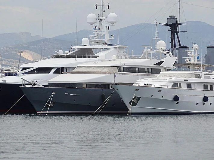 a couple of large white yachts aboard BELLA STELLA Yacht for Charter