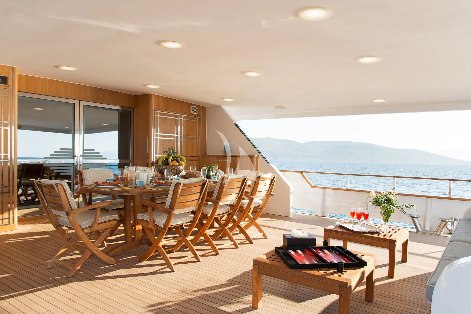 a room with a table and chairs aboard BELLA STELLA Yacht for Charter