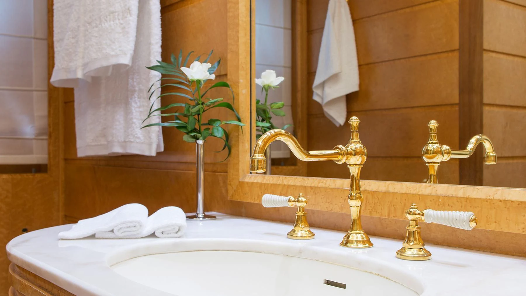 a bathroom with a vase of flowers aboard BELLA STELLA Yacht for Charter