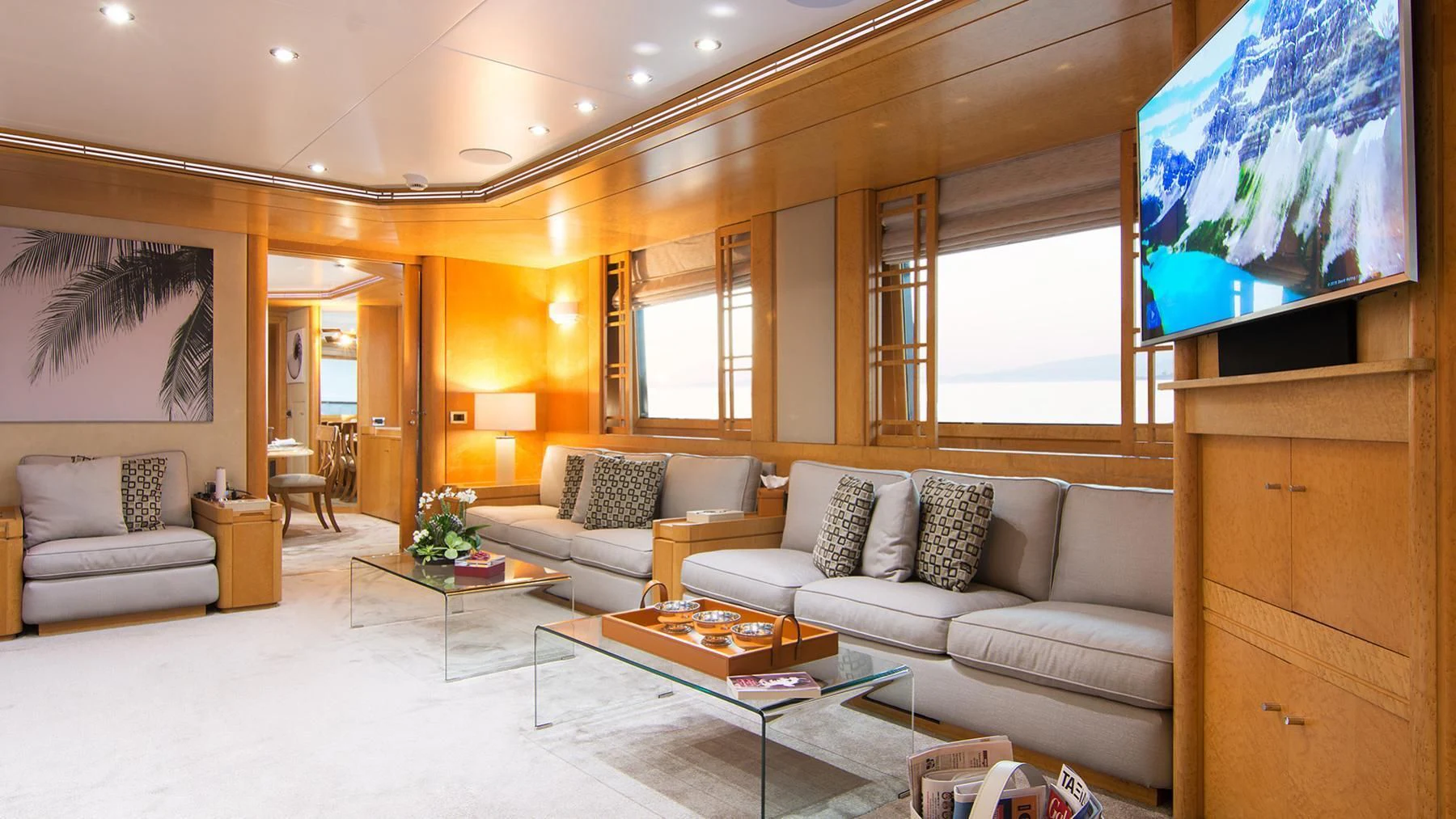 a living room with a large screen aboard BELLA STELLA Yacht for Charter
